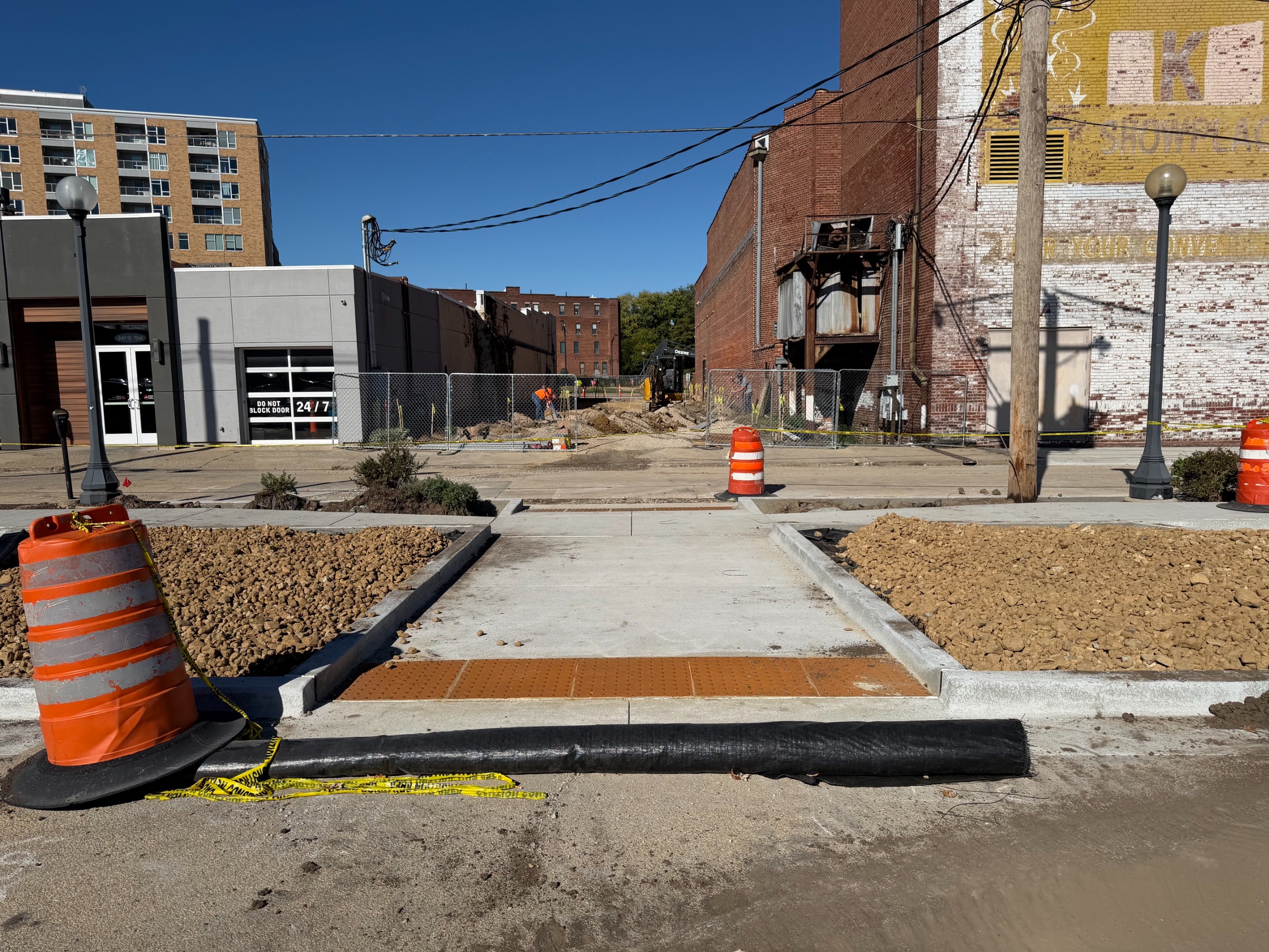 Photo of a newly poured wheelchair ramp connecting the Washington and Walnut Street parking lot (200 spaces) to the lot south of the Orpheum, which will serve as an entry to the Downtown Plaza.