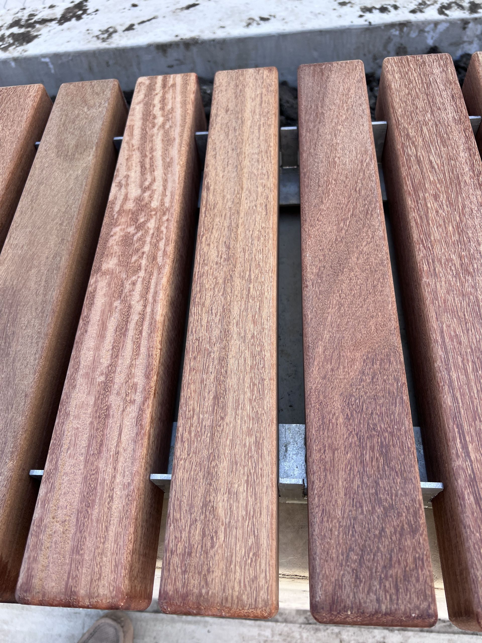 Close up of the wood slat panels of the plaza benches.